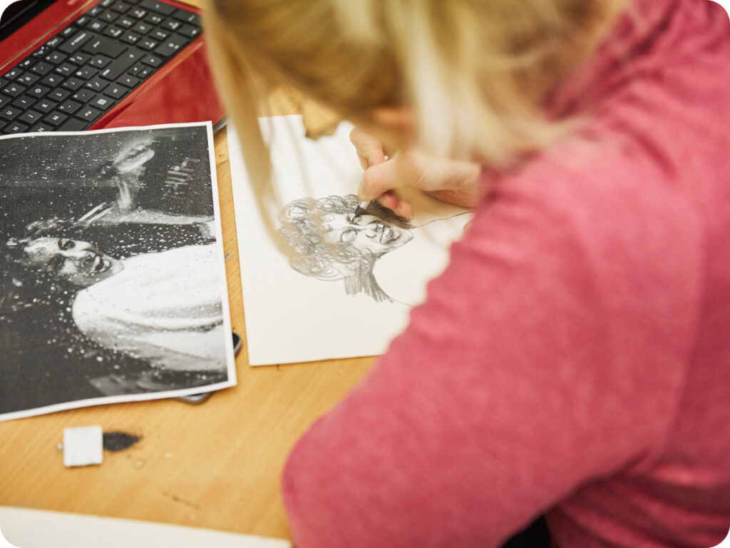 Northbrook college art student drawing a picture