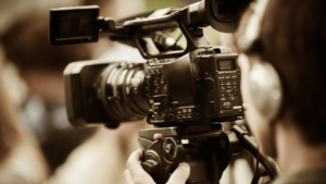 Stock image of someone using a video camera +