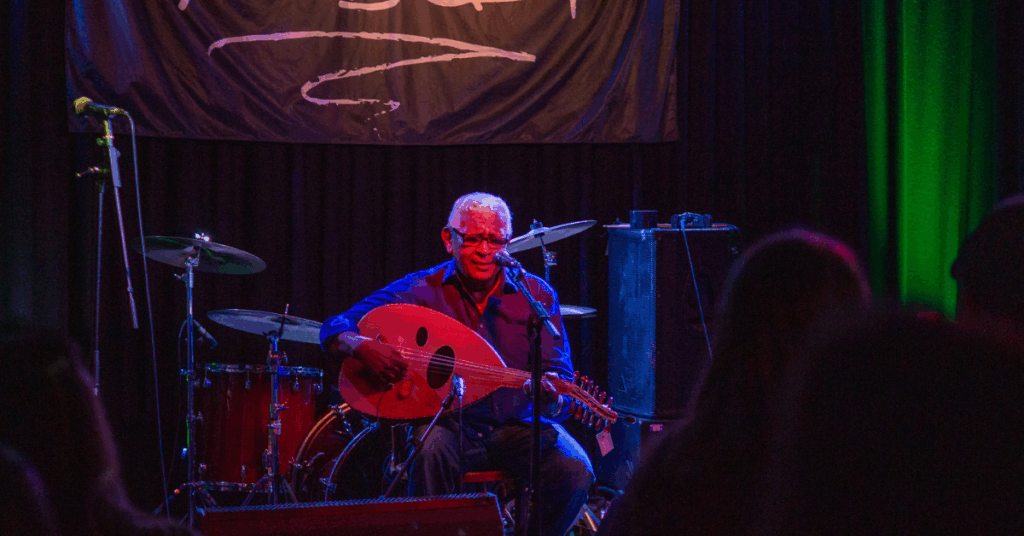 Bashir Al Gamar performing on stage during the gig at the Prince Albert