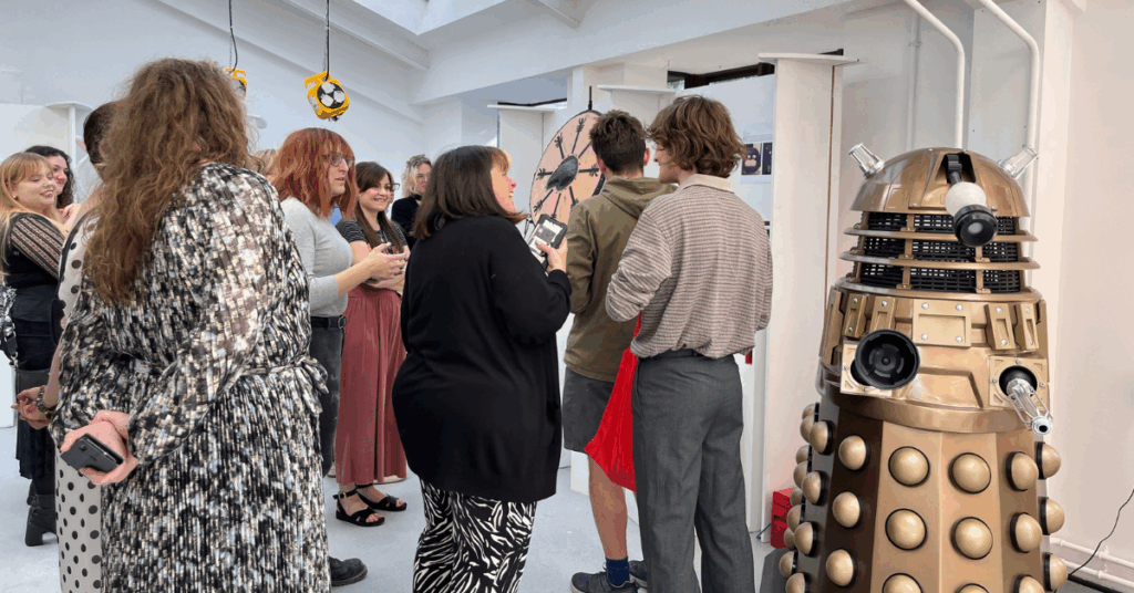 Visitors admiring one of the many rooms of student artwork