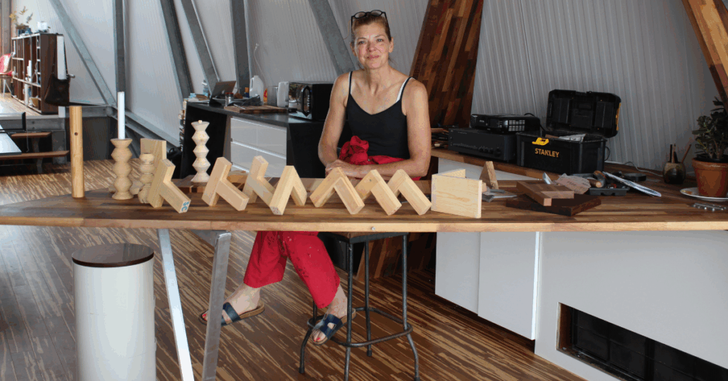 Sarah sat with some of her woodwork from her course