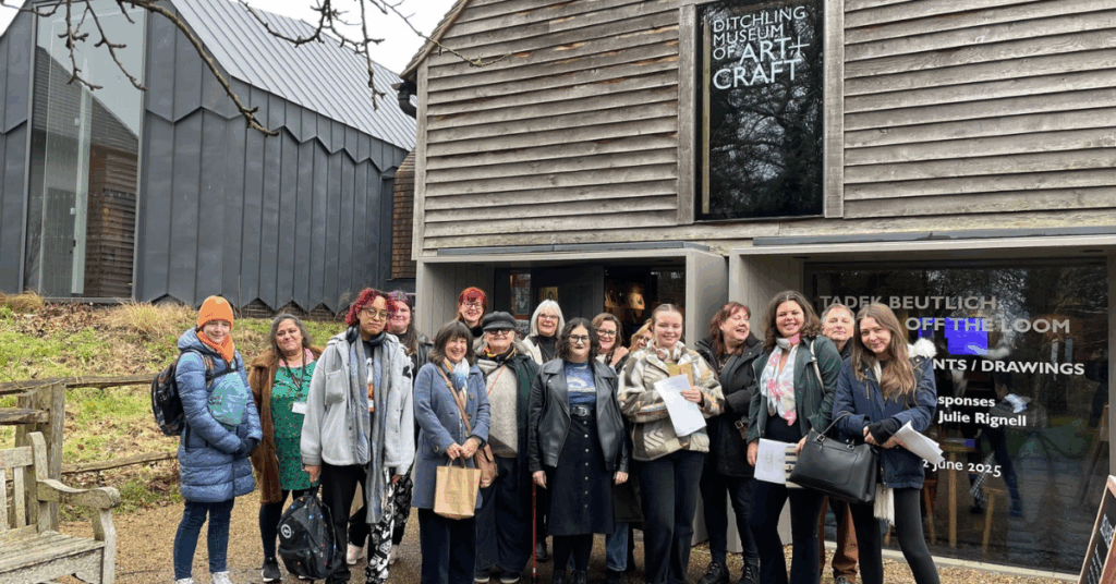 Some of the college's students and staff stood outside the museum