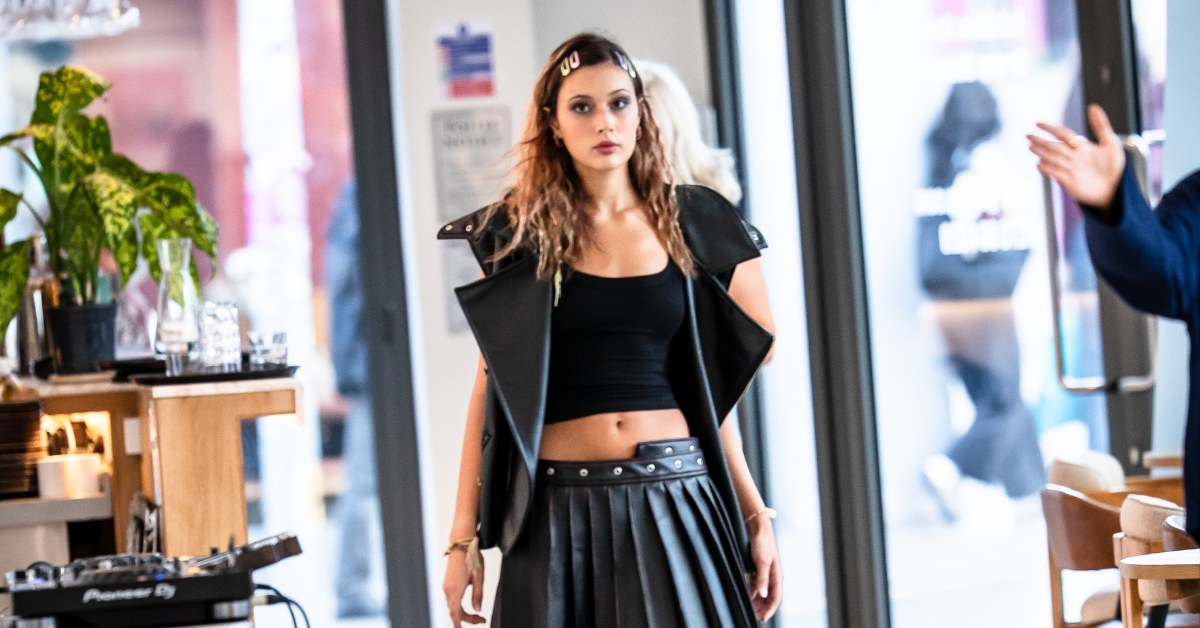 One of the students exhibiting their work on the runway