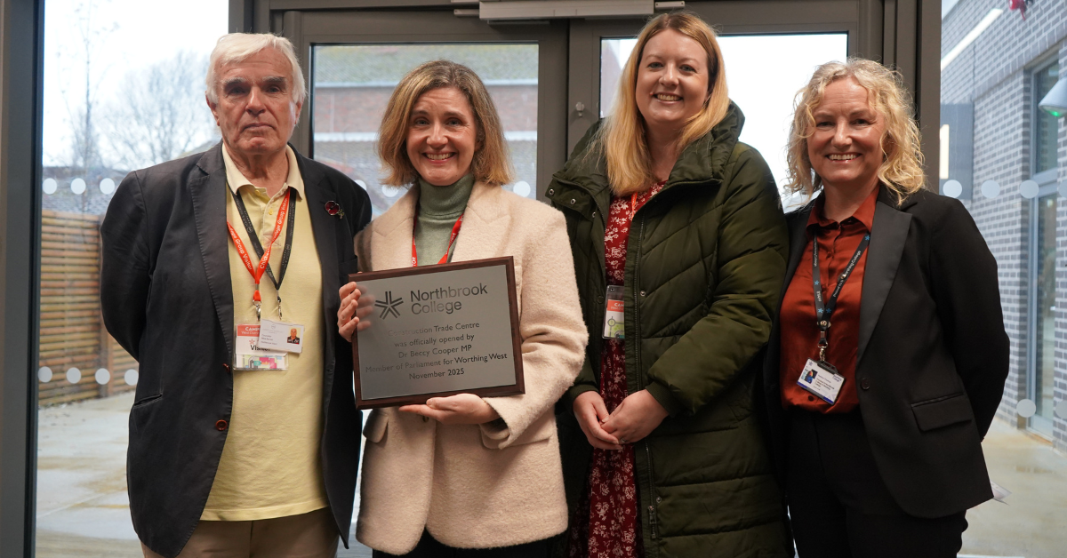 Dr Beccy Cooper, Helena Thomas, and members of Worthing District Council pictured in the foyer of the new centre, with Beccy Cooper holding a plaque