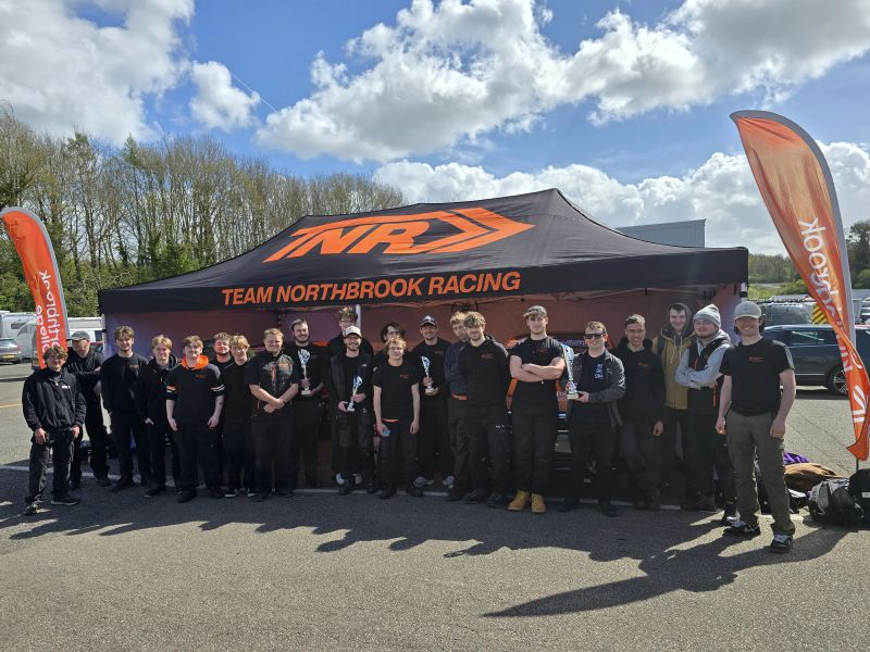 Our talented TNR team stood under their pit marquee