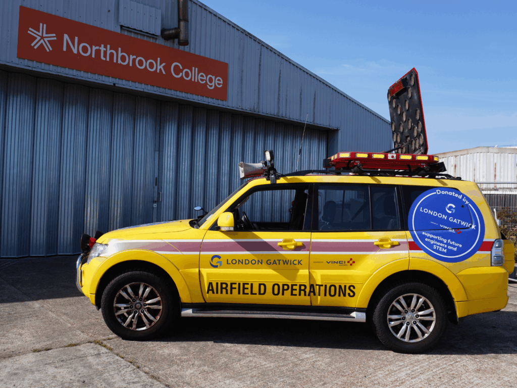 The newly donated Mitsubishi outside the hanger at the college's Shoreham Airport campus
