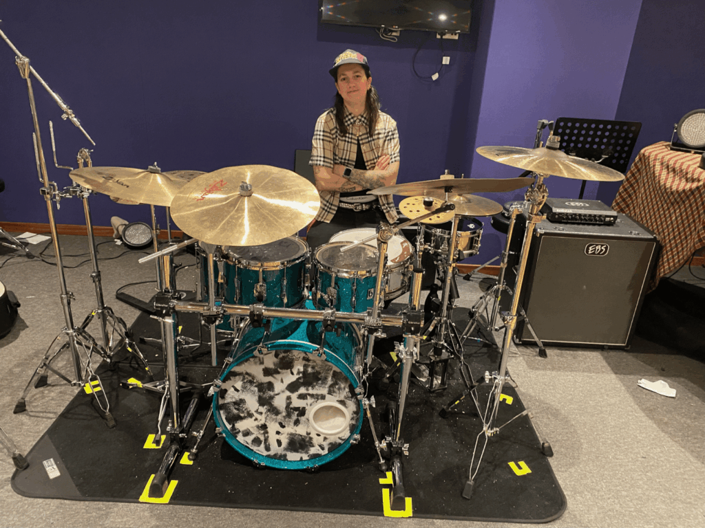 Gabi sat behind one of the drumsets in the college